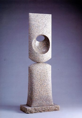 HOLE IN SPACE AND TIME, PINK GRANITE, 51 INCHES HIGH, 2010, ONE CIRCULAR VOID AND STIPPLED SURFACE.