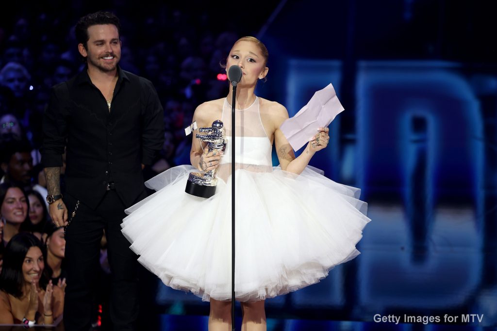 ELMONT, NEW YORK - SEPTEMBER 07: Ariana Grande accepts the Video of the Year Award for “Brighter Days Ahead” onstage with Christian Breslauer (L) during the 2025 MTV Video Music Awards at UBS Arena on September 07, 2025 in Elmont, New York. (Photo by Manny Carabel/Getty Images for MTV)